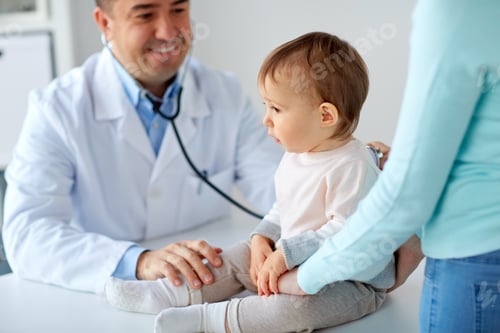Preview: doctor with stethoscope listening baby at clinic