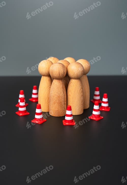 Preview: A group of people are surrounded by restrictive road cones.