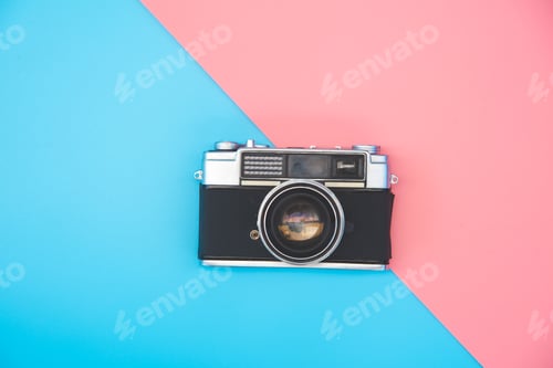 Preview: Old film camera placed in the color background