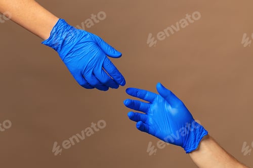 Preview: Male and female hands in medical gloves stretch to each other. Help concept