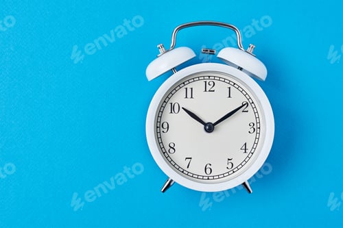 Preview: Vintage white alarm clock on the blue backround with copy space. Time concept
