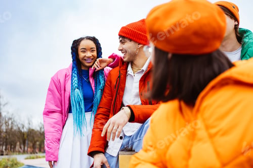 Preview: Multiracial group of young friends meeting outdoors in winter