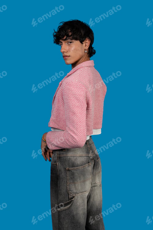 Preview: Young latin model posing with pink cropped jacket and grey jeans