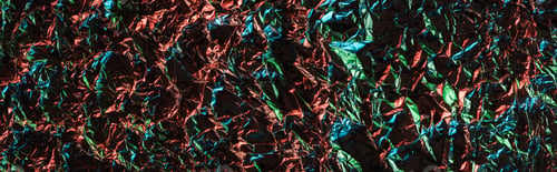 Preview: panoramic shot of crumpled textured foil with colorful illumination