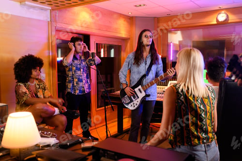 Preview: Professional diverse musicians at music studio recording songs.