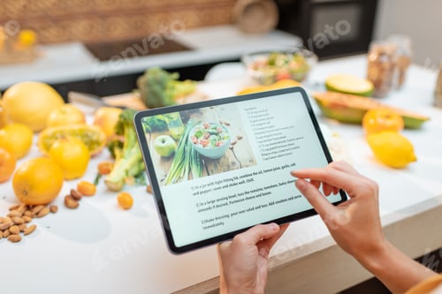 Preview: Cooking food using recipe on a digital tablet