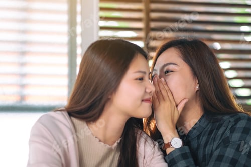 Preview: Two female friends telling and gossiping the secret