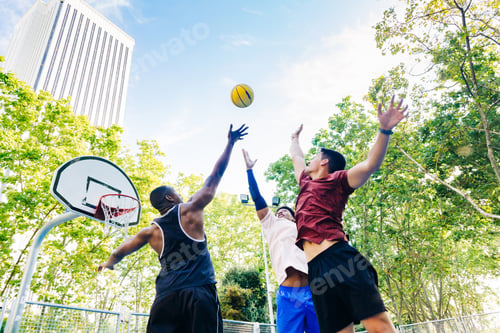 Preview: Group of friends jumping and tossing ball up