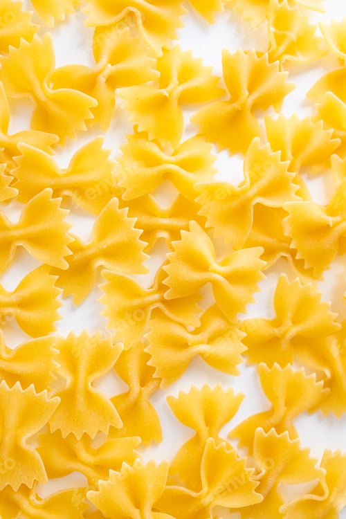Preview: pasta farfalle of light dough, close up , top view. Italian food.