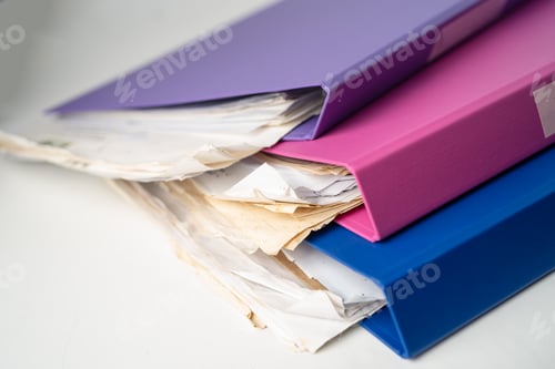Preview: File Folder Binder stack of multi color on table in office.