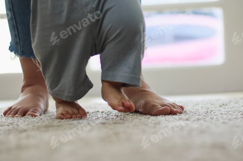 Preview: Asian mothers are training their baby to walk.