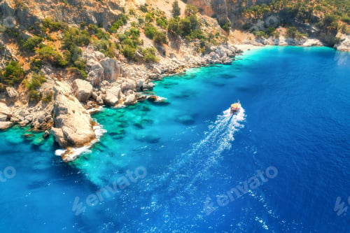 Preview: Speed boat in blue sea at sunrise in summer. Aerial view