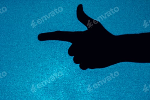 Preview: Hand of a person gesturing with the gun sign