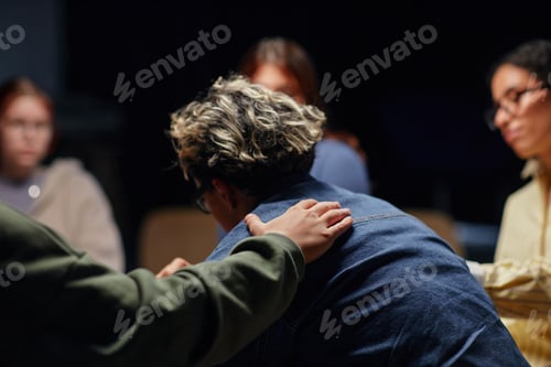 Vista previa: Diverse Young Adults Comforting Friend during Emotional Support Group Meeting