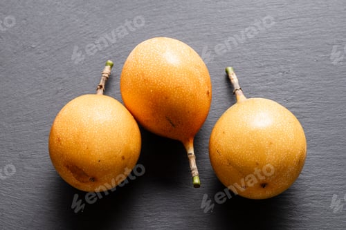 Preview: Three Ripe Passion Fruits On Slate Background