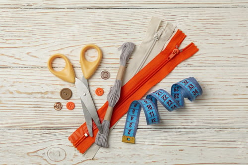 Preview: Sewing supplies on white wooden background, top view
