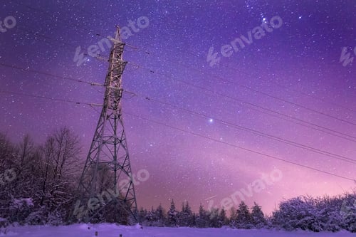 Preview: Beautiful view of an electricity transmission line tower in the winter evening