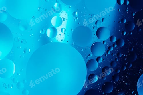 Preview: oil with bubbles on on dark blue background. Abstract background