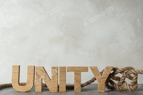 Preview: The word "unity" in wooden letters with a rope. Place for text