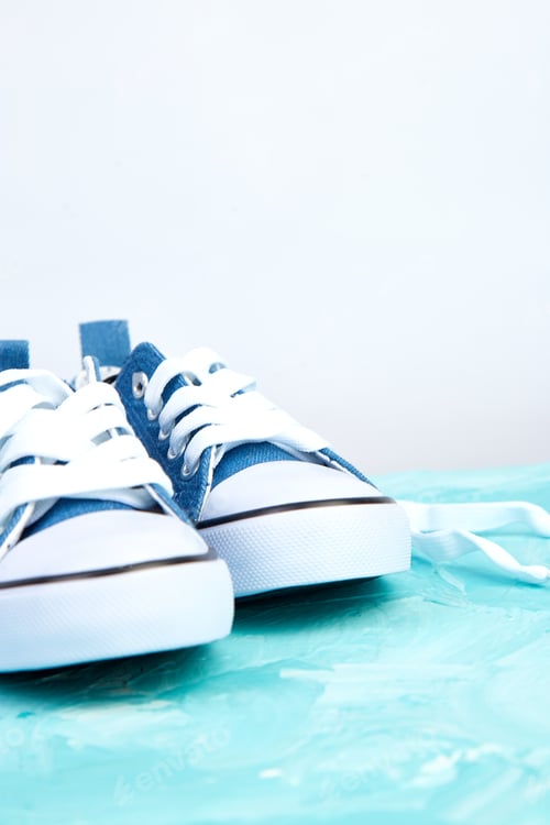 Preview: Denim Sneakers on a Blue Background