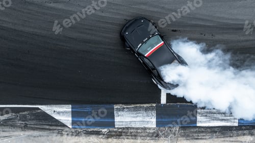 Preview: Aerial top view high speed car drifting on asphalt race track with lots of smoke.