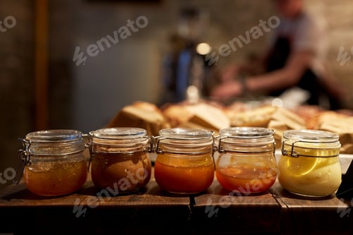 Preview: jars with craft jam or sauce at grocery store