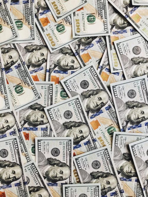 Preview: Top view new styled American hundred dollar bills background abundance at natural light
