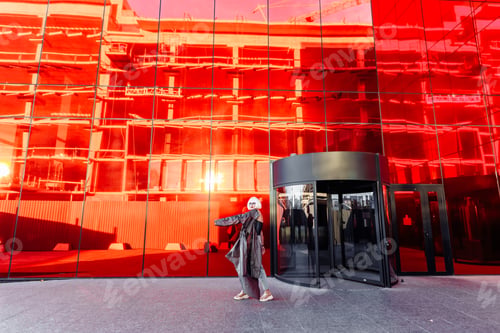 Preview: Fashion portrait of a blonde on a red background.