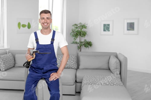 Preview: Dry cleaning worker with professional apparatus indoors