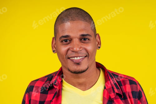 Preview: arabic brazilian man posing at studio in yellow background