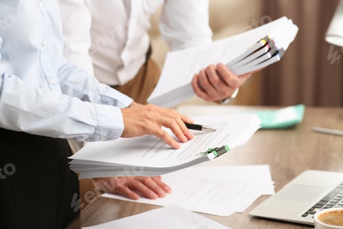 Preview: Businesspeople working with documents in office, closeup