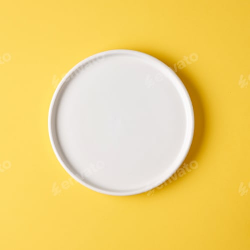 Minimalist White Plate on Bright Yellow Background