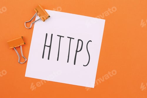 Preview: Note written on a white sticker with paper clip on a orange background . Inscription HTTPS