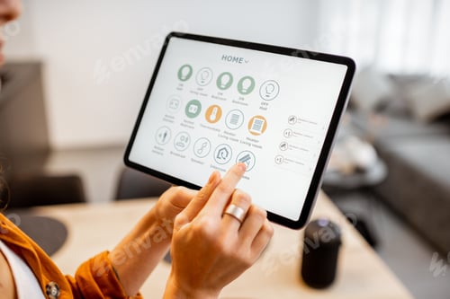 Preview: Woman controlling smart devices with a digital tablet at home