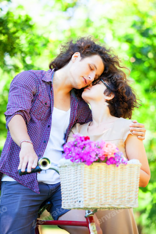 Preview: Couple with retro bike in the park