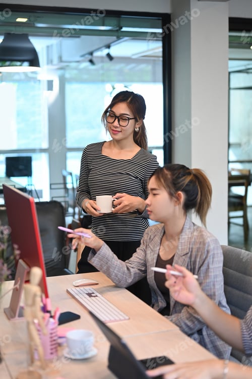 Preview: Team of software developers working together for developing website design and coding technologies.