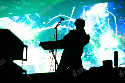 Preview: singer silhouette in stage lights live concert