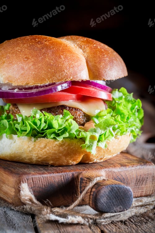 Preview: Closeup of cold drink with homemade burger