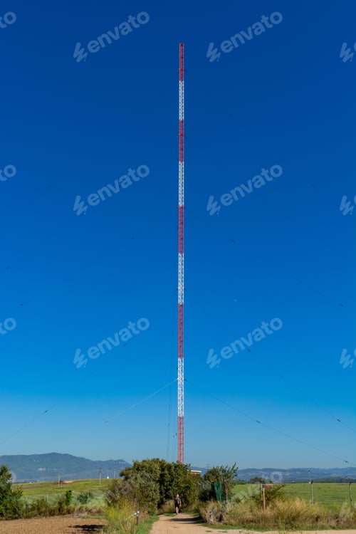 Preview: Vertical shot of radio antenna under a blue and clear sky