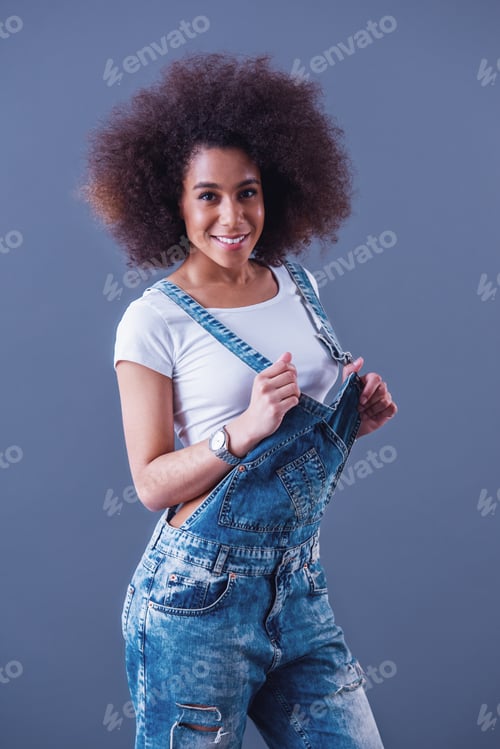 Preview: Beautiful woman in jean overalls