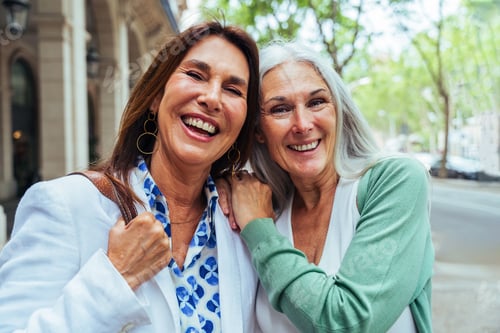 Preview: Beautiful senior women meeting outdoors in the city