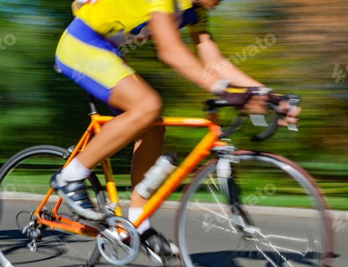 Preview: Racing Bicycle In Blurred Motion Speeding Down The Road.