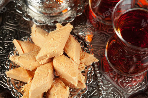 Preview: Bowl with pieces of turkish delight lokum and black tea