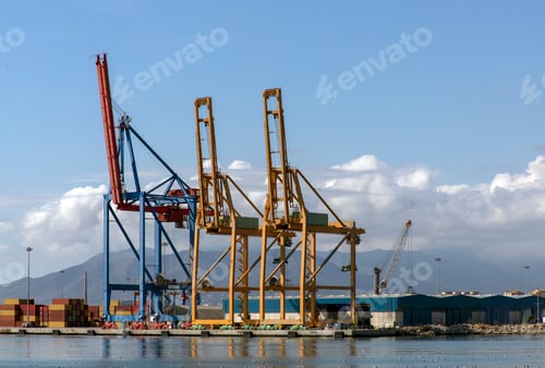 Preview: Photo of Heavy load dockside cranes in port, cargo container yard, container ship terminal