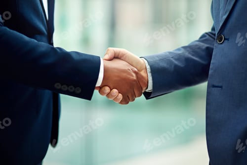 Preview: Cropped shot of two unidentifiable businessmen shaking hands in the office
