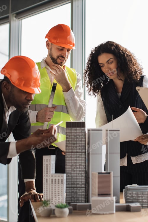 Preview: Architects Reviewing Building Model