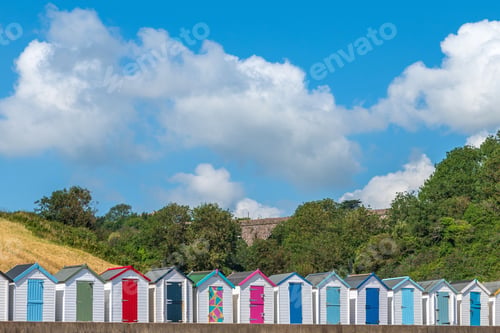 Preview: Colorful small beach houses. Multicolored beach sheds. Variety of painted beach shacks. Beach huts.