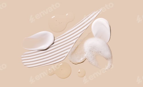 Preview: samples of cosmetic care products smear of cream texture on a beige background