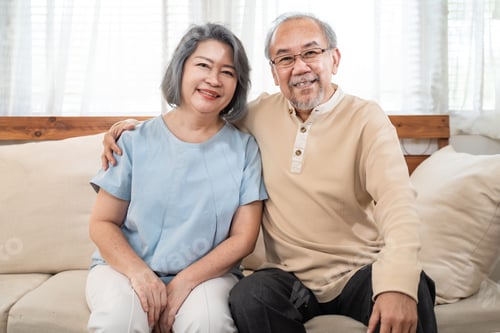 Preview: Happy Asian senior elder Couple in kitchen at home enjoy retirement life together and look at camera