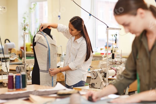 Preview: Designer working with model of suit